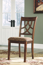 Load image into Gallery viewer, Leahlyn - Medium Brown - 6 Pc. - Round Dining Room Table, 4 Upholstered Side Chairs