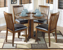 Load image into Gallery viewer, Stuman - Medium Brown - 5 Pc. - Round Drop Leaf Table, 4 Upholstered Side Chairs